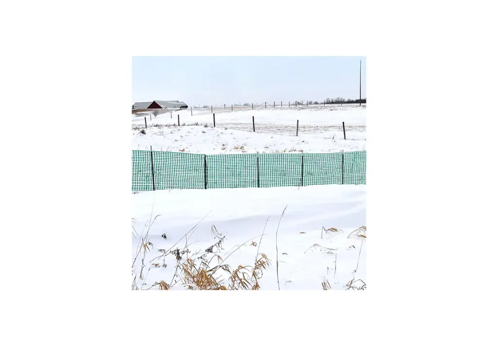 4 ft. x 100 ft. Outdoor Plastic Snow Fence, 1.6" x 1.6" in snow.webp